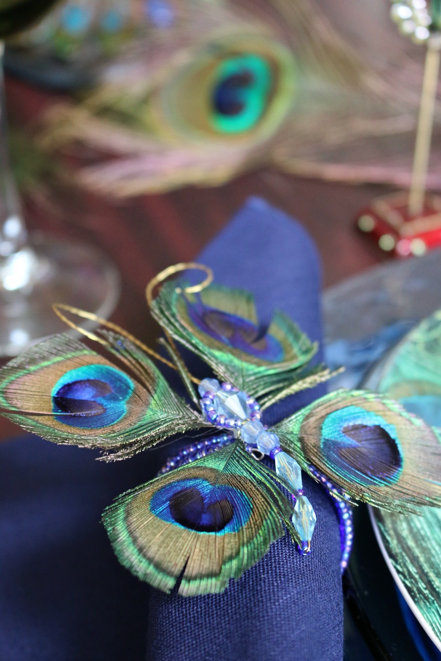 Peacock Napkin Ring - sometimes by purchasing one thing you love, you can build an entire Table Scape. Like this Peacock inspired Table Setting.