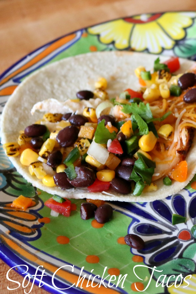 Corn tortilla layered with roast chicken, Mexican cheese, salsa and black bean and roasted corn tortilla.