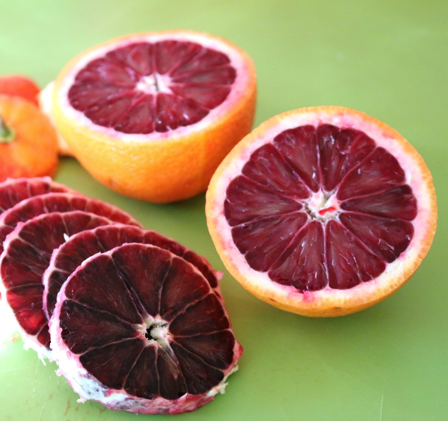 A Blood Orange is very beautiful. No worry it is not GMO, it is a nature occurring mutation.