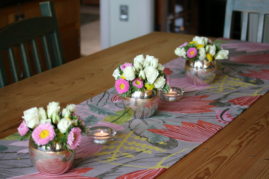 I enjoy fresh flowers . . . it was my son's birthday so I wanted to make the table look nice for his birthday dinner. I grouped three small floral centerpieces for a beautiful statement.